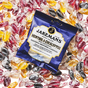 Jakemans Menthol & Eucalyptus Lozenges bag packaging menthol eucalyptus flavour 12 x 73g serving suggestion image