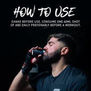 Man drinking from a supplement bottle with text on how to use it against a black background