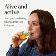 Symprove Liquid Probiotic Mango Passionfruit Flavour 500ml probiotic drink lifestyle woman drinking