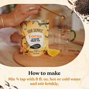 How to Use: Spooning Four Sigmatic instant tea powder into a mug of hot or cold water.