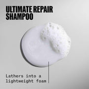 Close-up of WELLA ULTIMATE REPAIR Shampoo label showing key features.