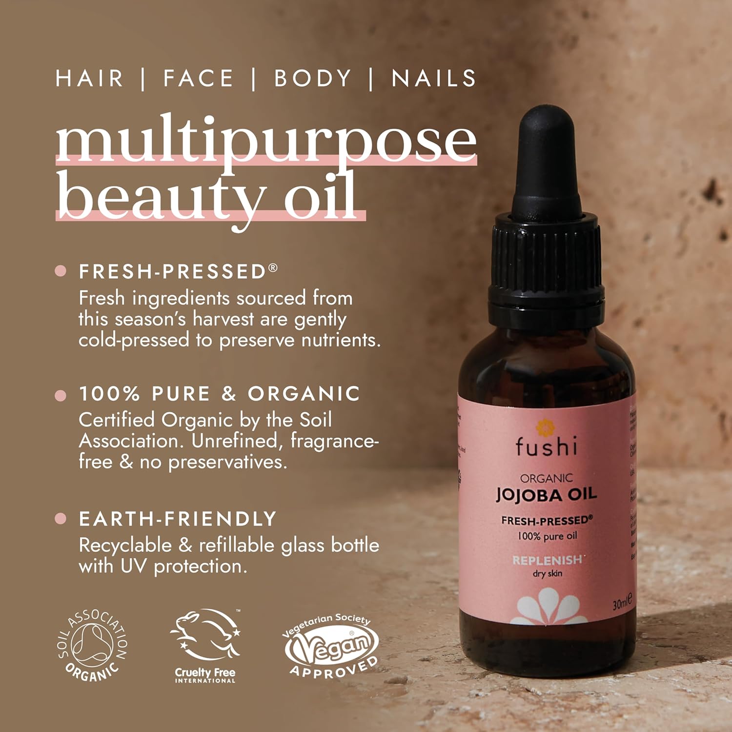 Fushi organic jojoba oil bottle with product details on a brown background