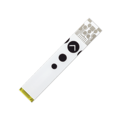 Single Accu-Chek Instant test strip isolated.