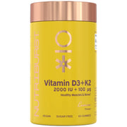 A yellow bottle of NutriBurst Vitamin D3+K2 gummies with a metallic rose gold cap, shown on a plain white background.
