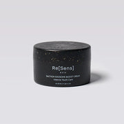 Black jar of Re[Sens skincare cream on a light gray background